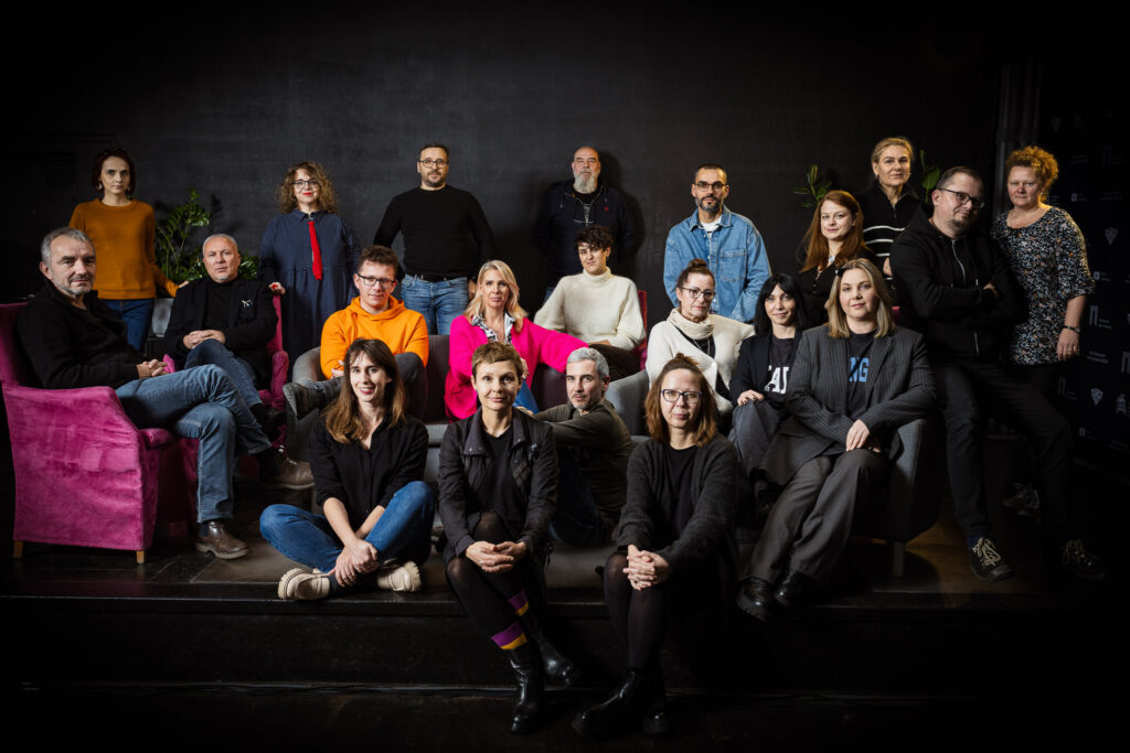 A portrait photo of the Wrocław Literature House team on the stage of Proza Club